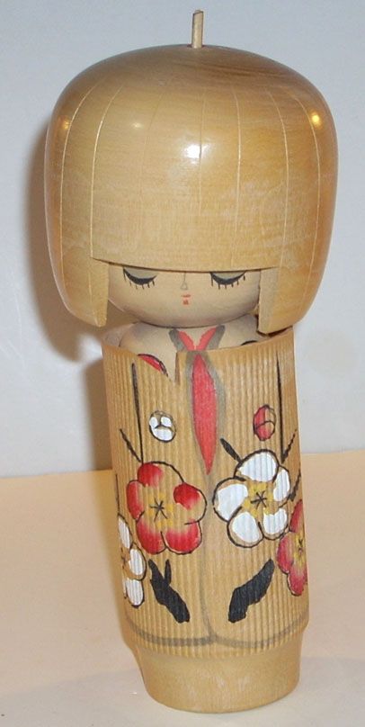 This is a Vintage 6 3/4 Traditional Japanese Wooden Kokeshi Doll.