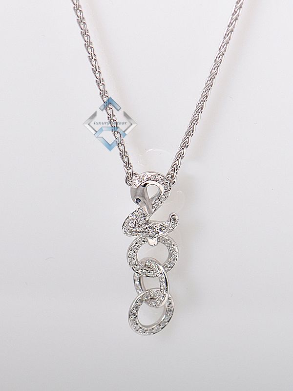   18K white gold necklace features a swan with a gracefully curved head